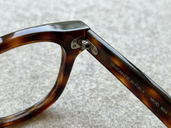 Quality construction details on designer eyewear showing hand-finished surfaces and precision craftsmanship
