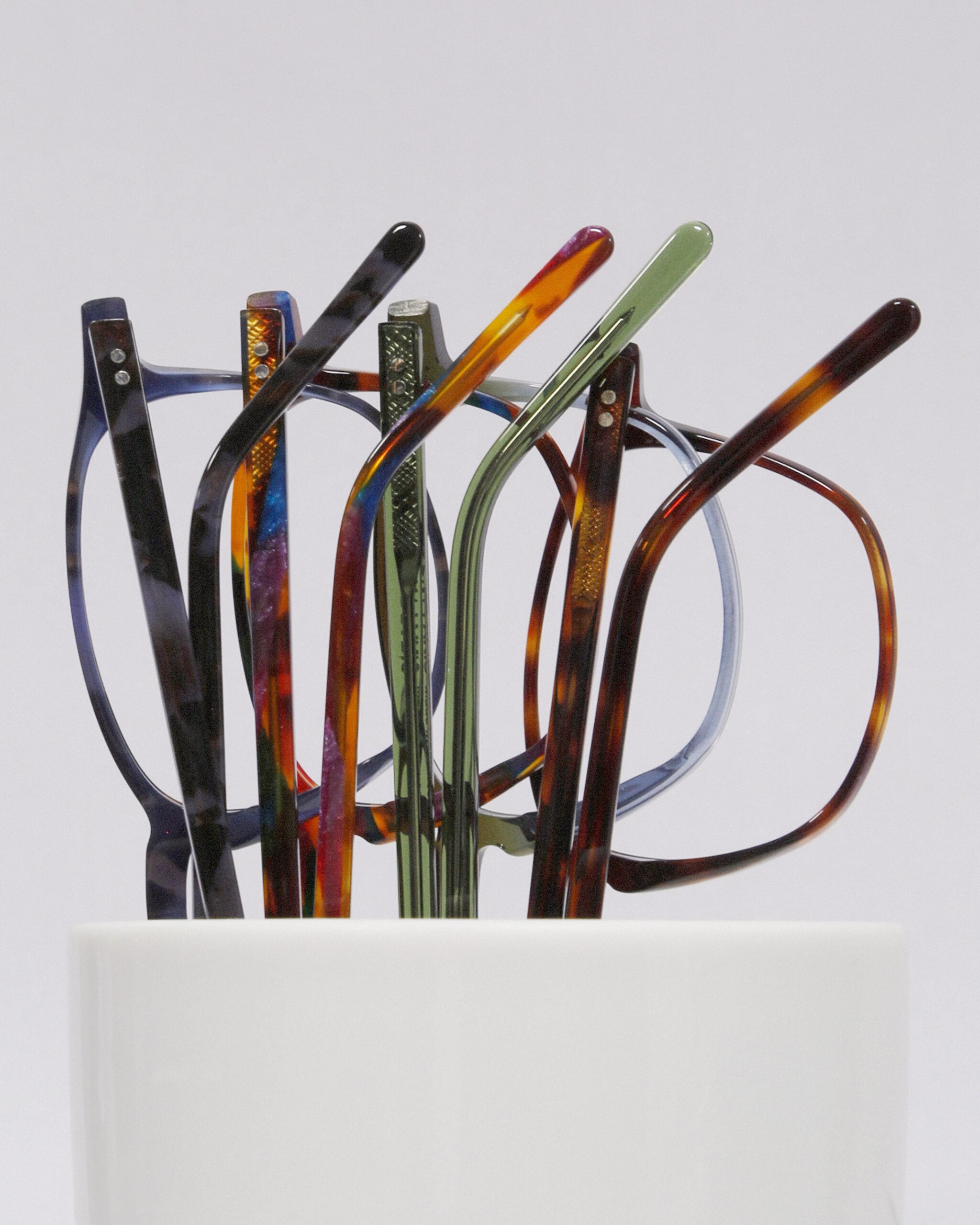 A holder full of colorful Lafont frames showing the brand's range of color combinations