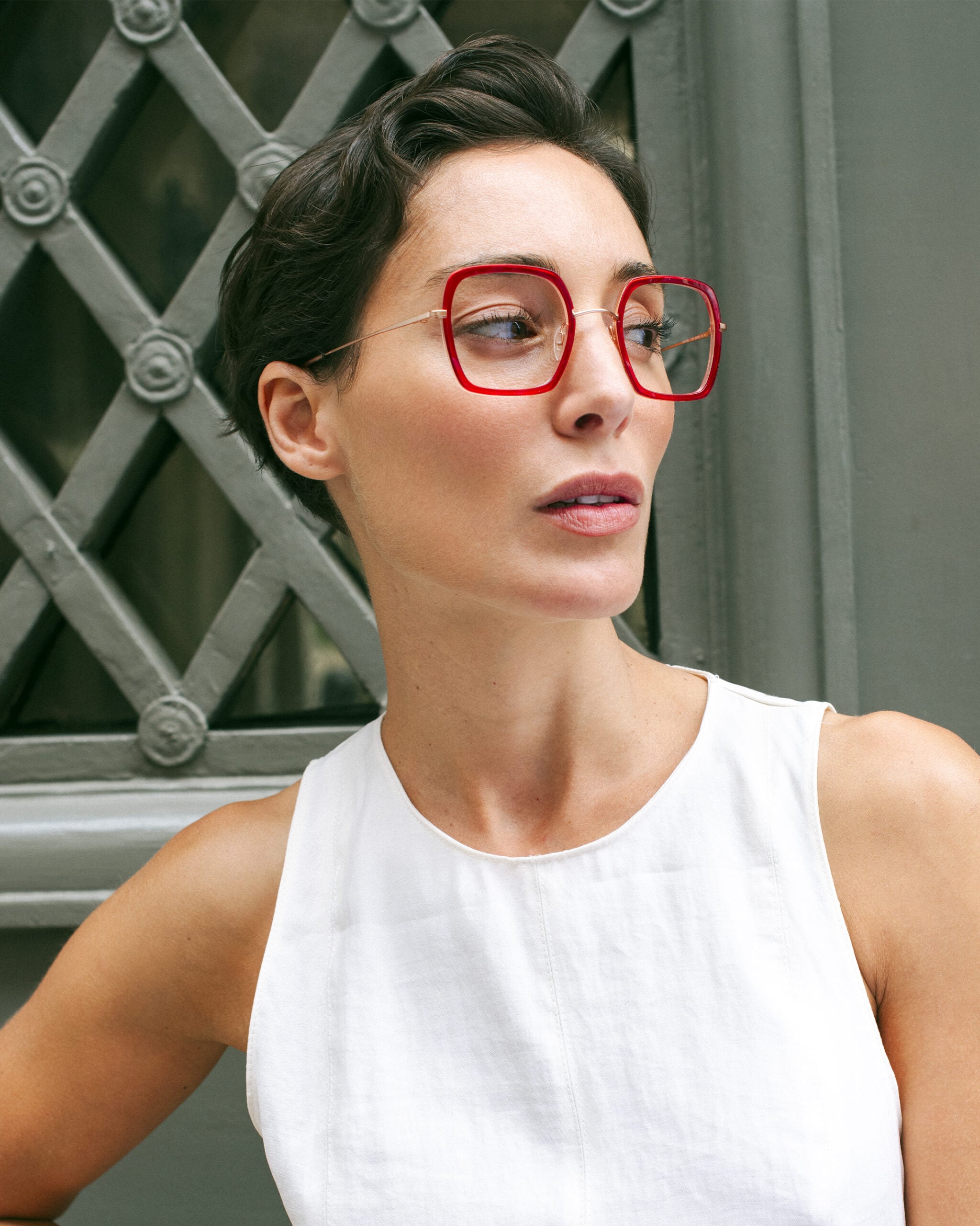 Woman in Paris wearing red Lafont eyeglass frames