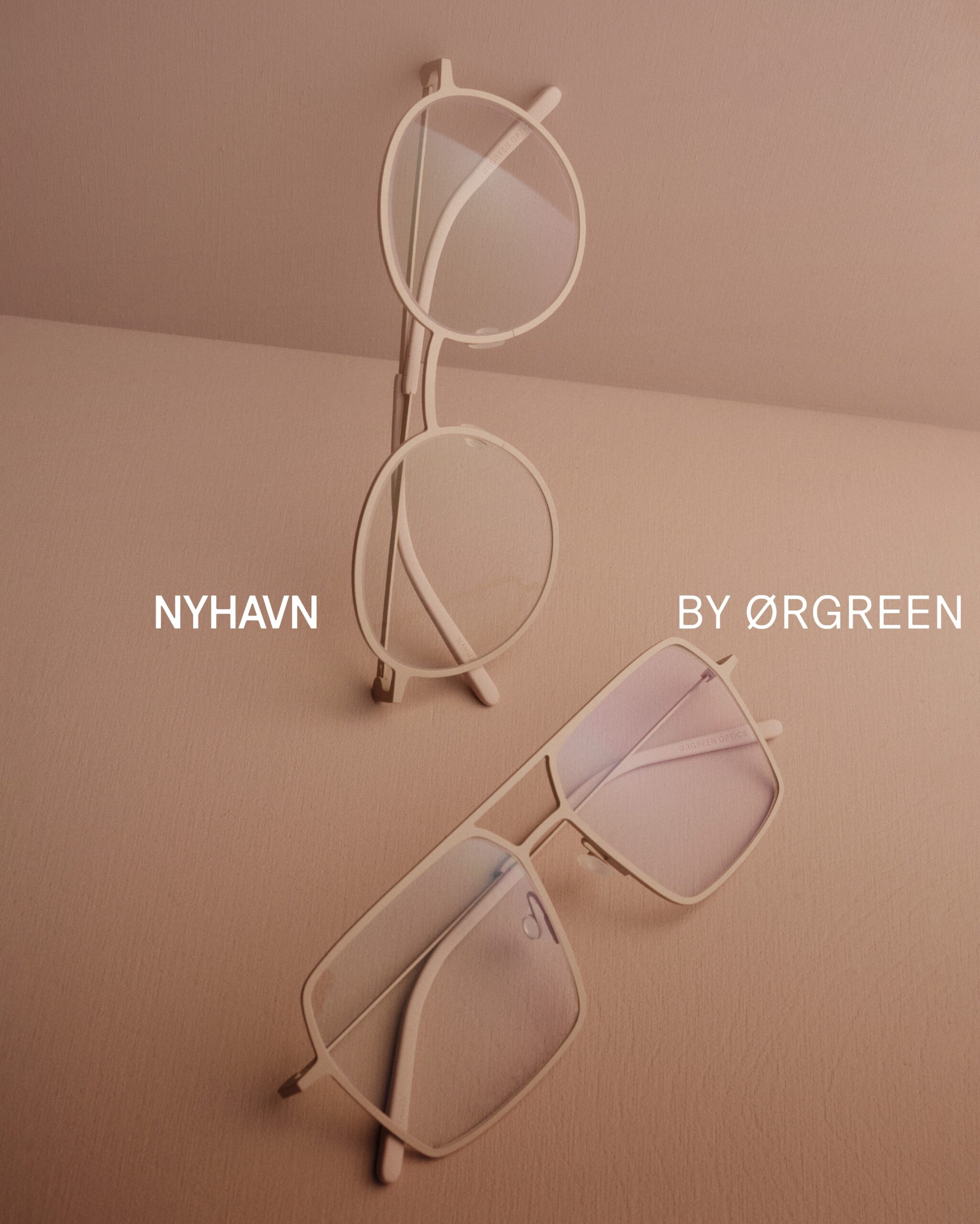Orgreen NYHAVN clear crystal frames on a taupe background, at City Optix on Chestnut Street