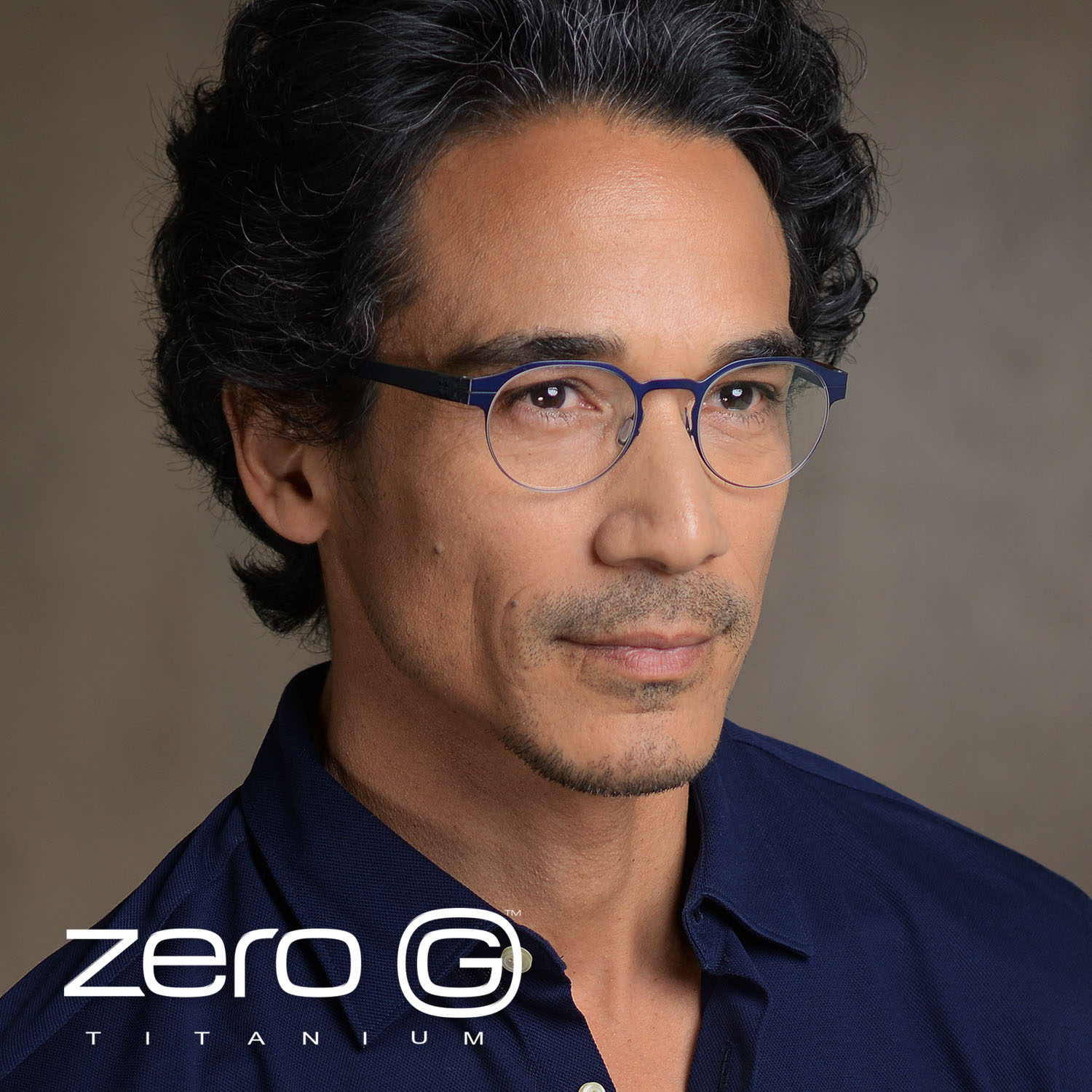 Man wearing round blue Zero G titanium frames