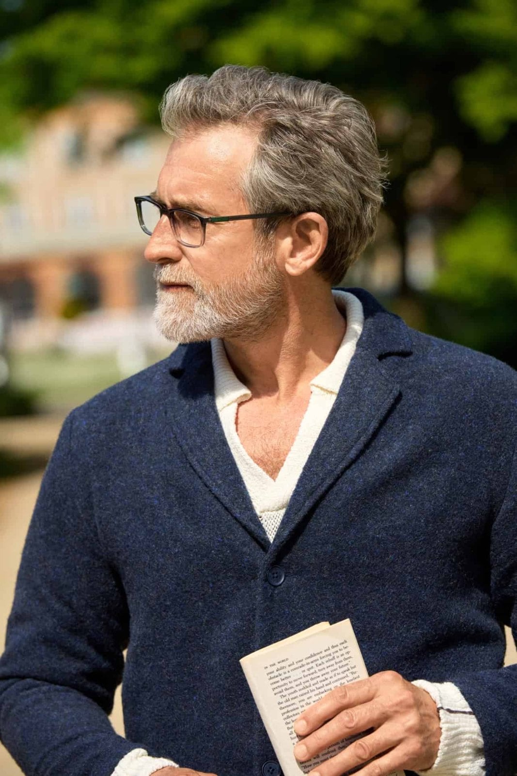 Profile view of a man wearing a dark ProDesign Denmark acetate frame, the temple running back along the side of his face.